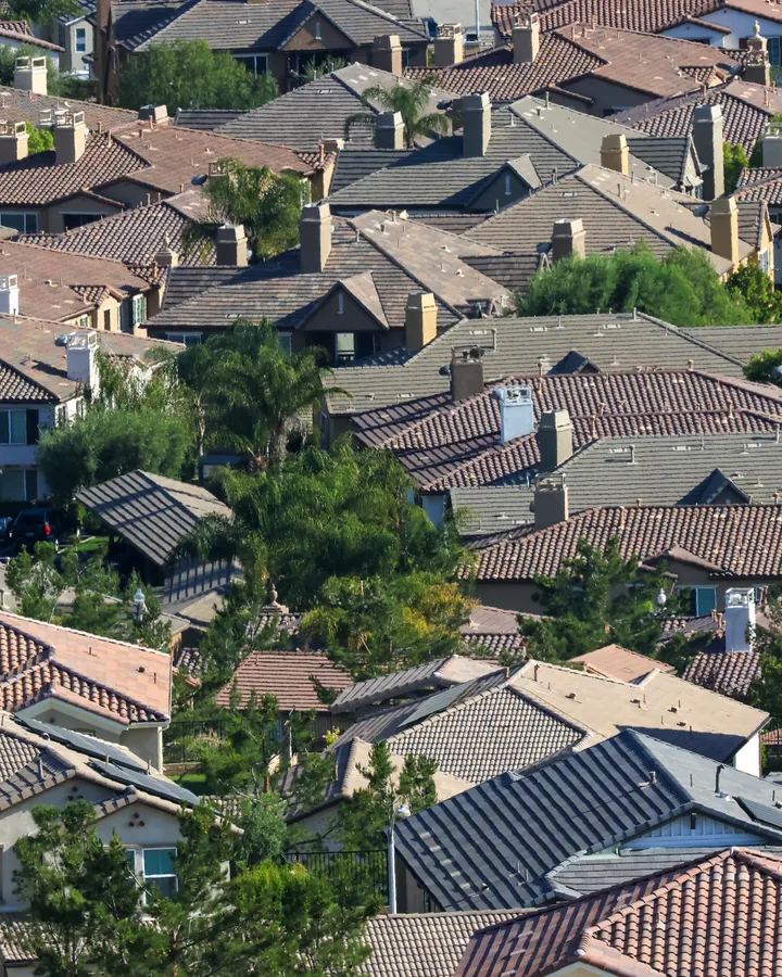 Refrigerator repair in Del Cerro, CA Aerial shot of a sunlit residential area with tiled rooftops, like Del Cerro’s hillside streets