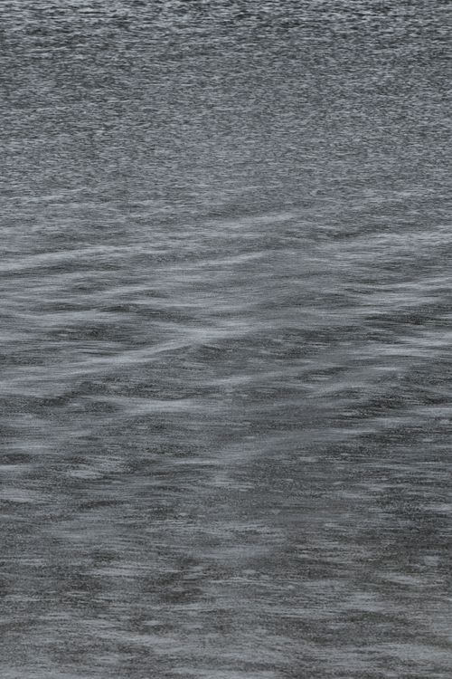 Free Close-up of rain gently falling on a calm body of water in Ningbo, Zhejiang, China. Stock Photo