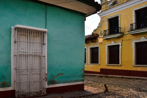 Free Charming colonial architecture with vibrant colors on a street corner in a historic town. Stock Photo