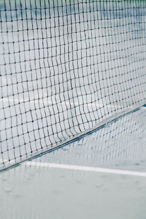 Net on Wet Tennis Court