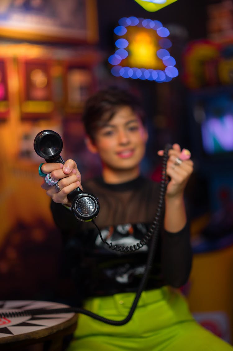 Woman Holding Vintage Telephone Handset