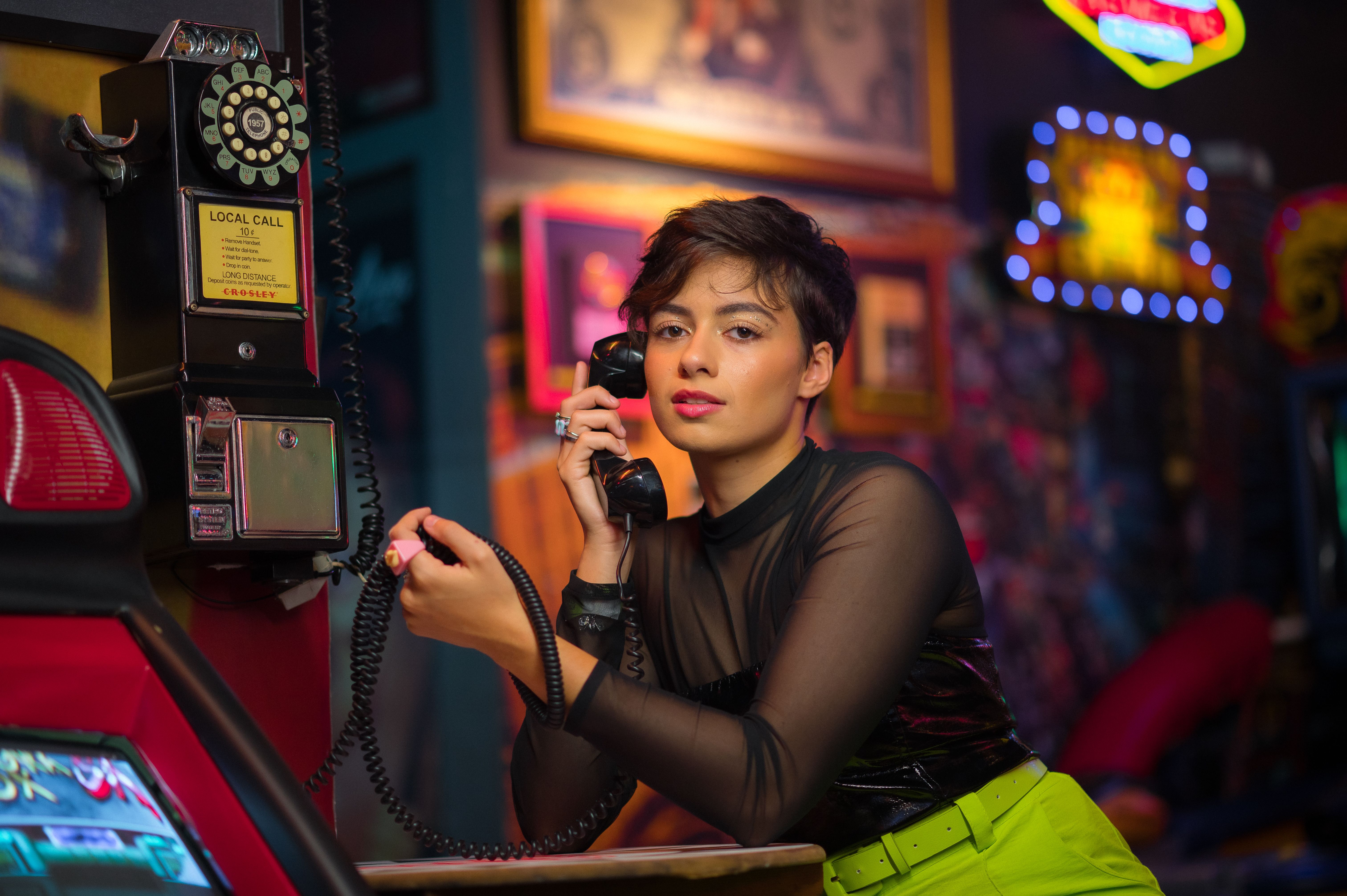 Telephone handset against dark bar counter at night