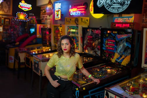 Woman Posing by Machines in Casino