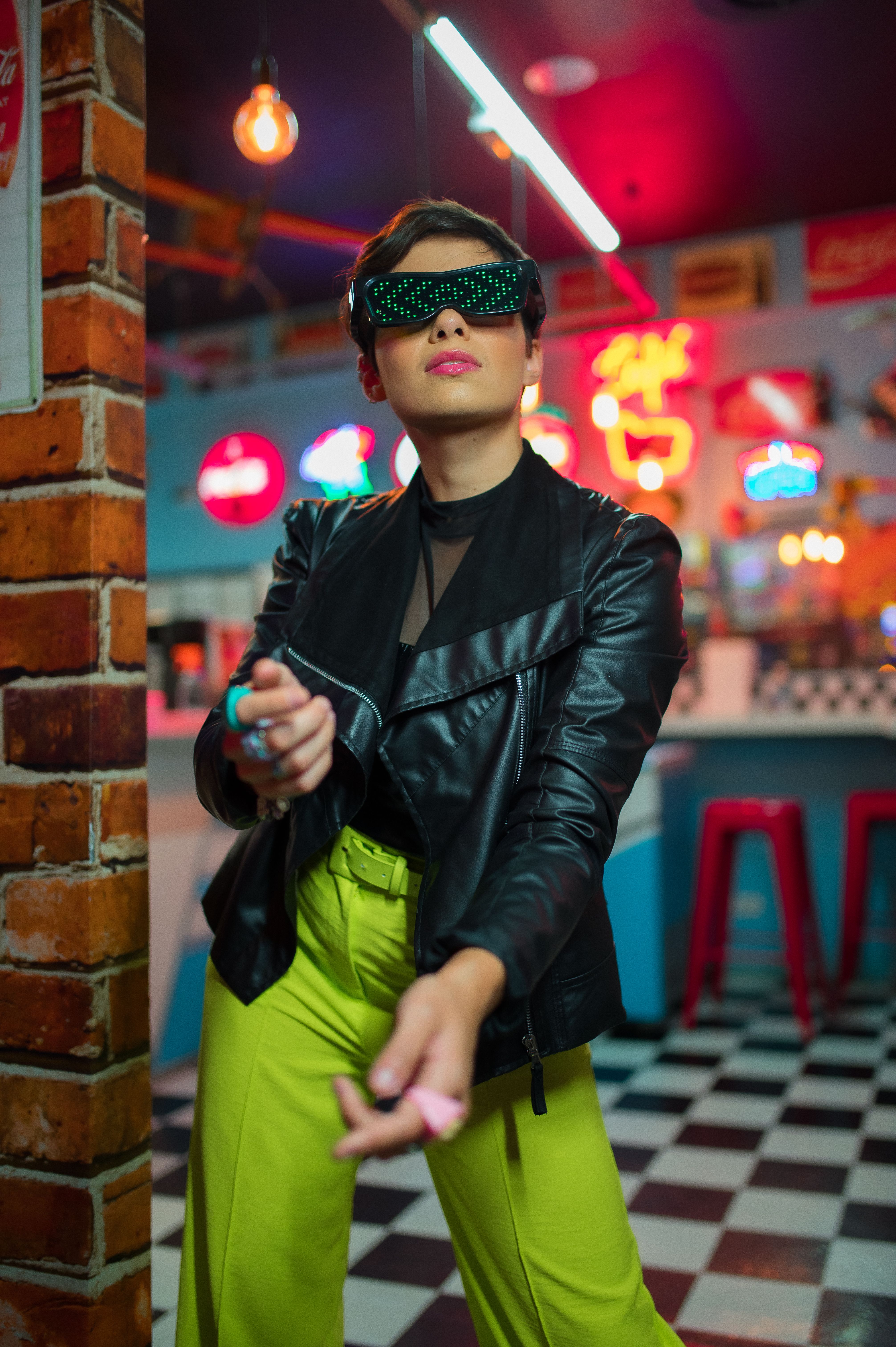 Woman Posing in Sunglasses and Black Jacket · Free Stock Photo