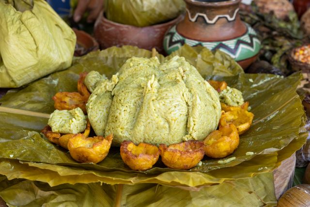 Close-up of traditional Peruvian juane served on leaves with fried plantains, highlighting cultural culinary presentation.