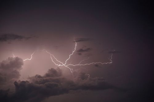 Free Captivating thunderstorm image showcasing vivid lightning against a dark sky. Stock Photo