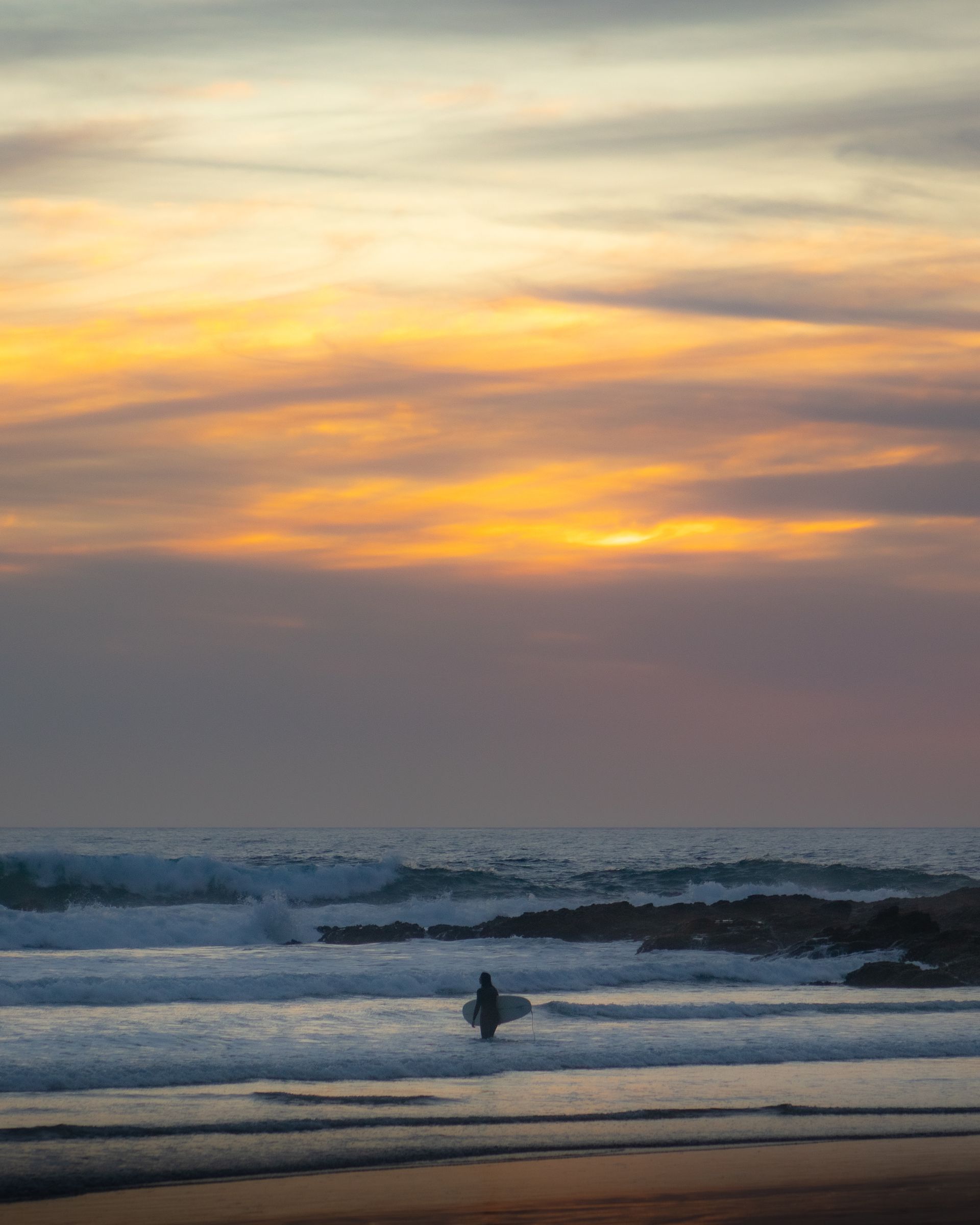 Surfer riding a wave in Los Cabos, Mexico