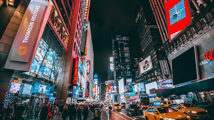 Crowd Of People On Street During Night Time