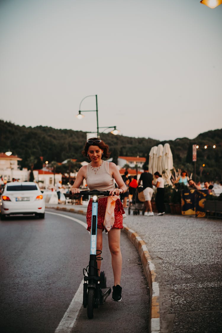 Woman Riding Electric Scooter