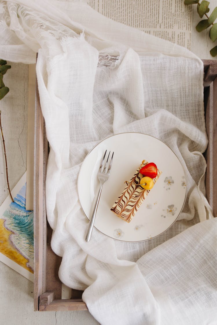 Top View Of Mille-Feuille Cake Decorated With Cherry And Strawberry