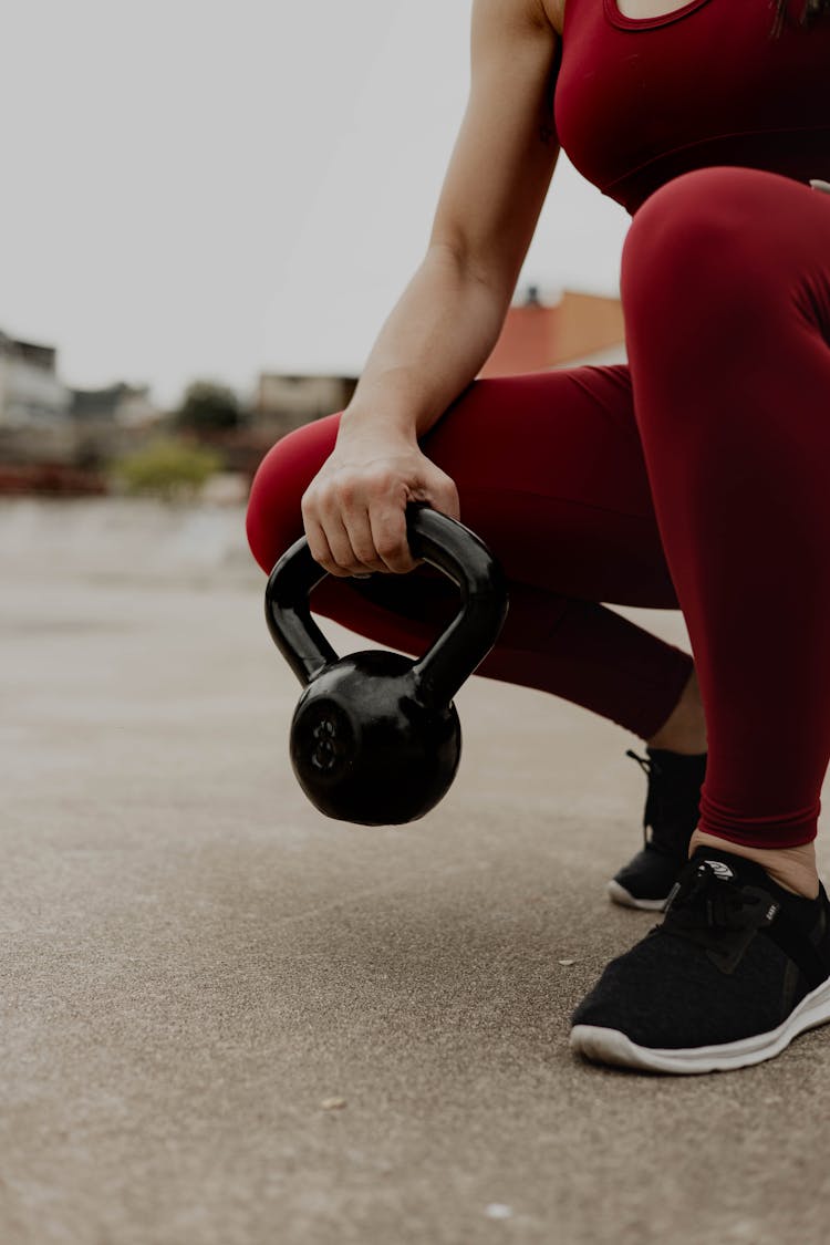 Close Up Of Woman Holding Dumbbell