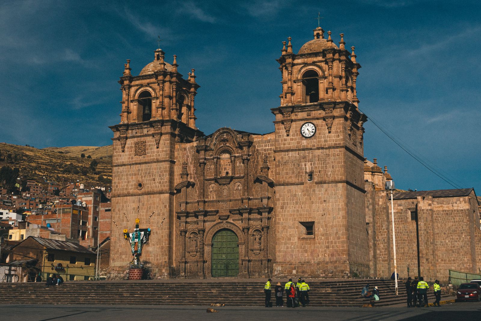 Puno colonial church bell towers with Lake Titicaca bridge