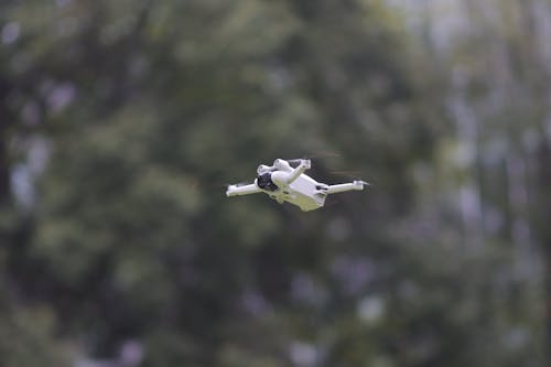 White Drone in Flight