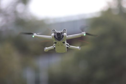 A cutting-edge drone in mid-flight showcasing advanced technology outdoors.