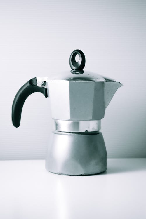 Shiny Aluminum Coffee Maker Standing on a Table