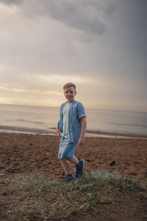Boy Walking on Beach