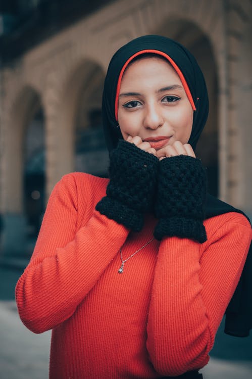 Woman In Red And Black Long Sleeved Top And Headdress