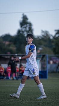 Young soccer player in action during a competitive outdoor match