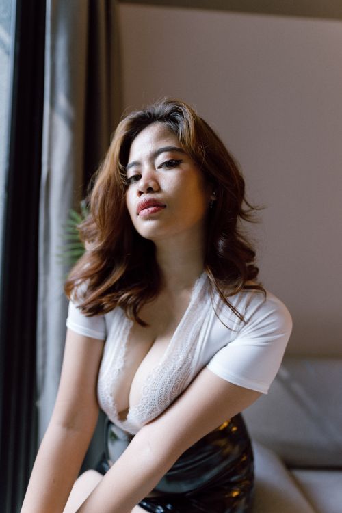 Free Elegant portrait of a fashionable woman in a white blouse in Kuala Lumpur. Stock Photo