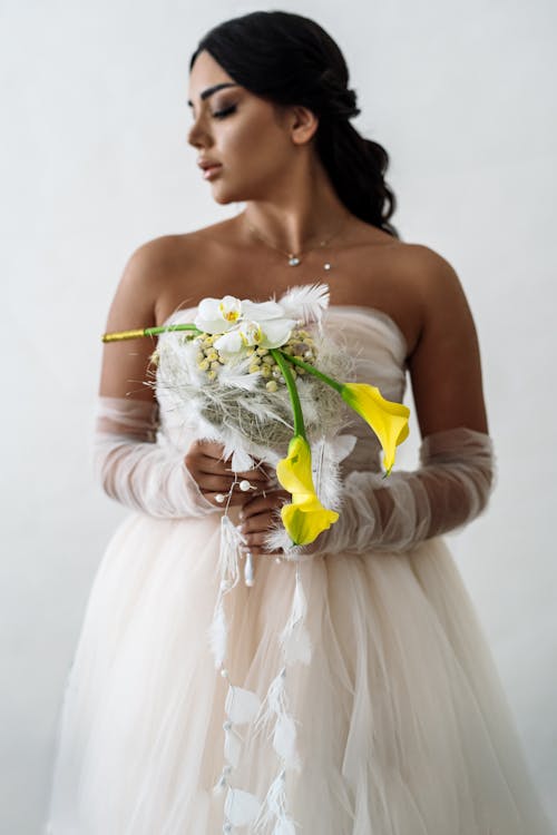 Portrait of a Bride Holding a Floral Decoration