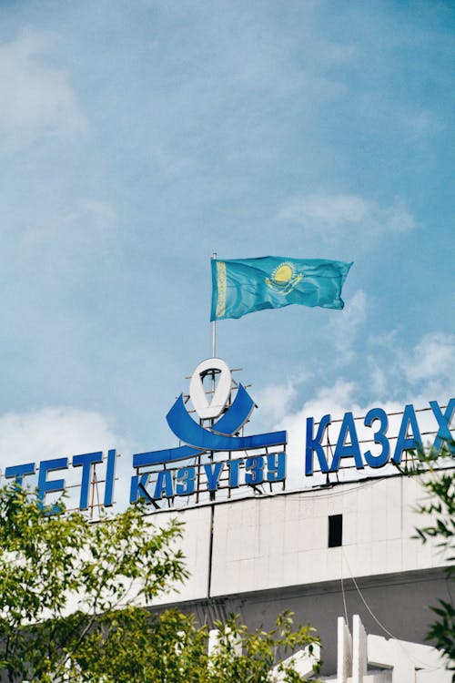 Facade of a Building with the Flag of Kazakhstan on Top 