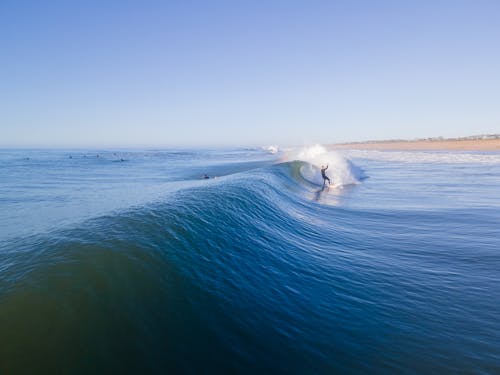 View of a Person Surfing a Large Wave 