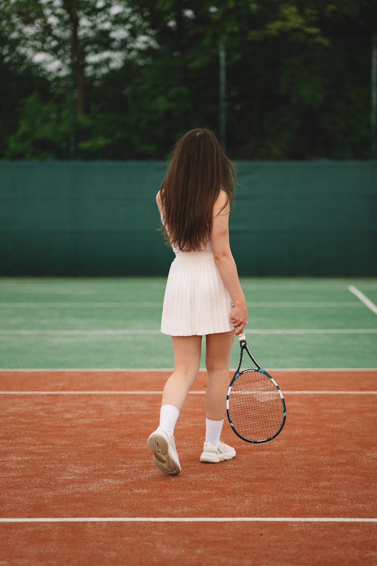 Young Woman Playing Tennis 