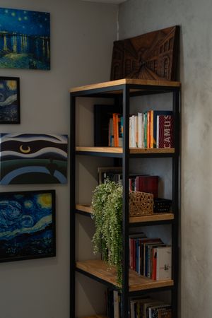 Bookshelf in a cosy corner by Wolf Art on Pexels