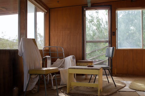 A room with a table and chairs in it