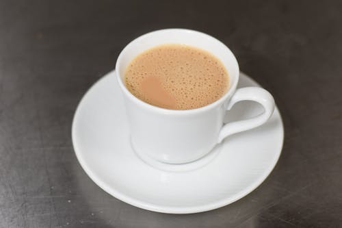 Close-up of a White Cup of Coffee with Milk 