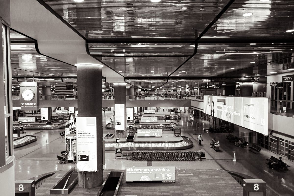 Baggage claim belt with luggage arriving