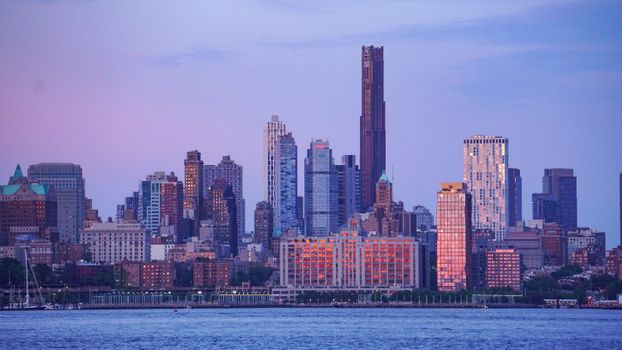 Stunning view of New York City skyline with skyscrapers at twilight.