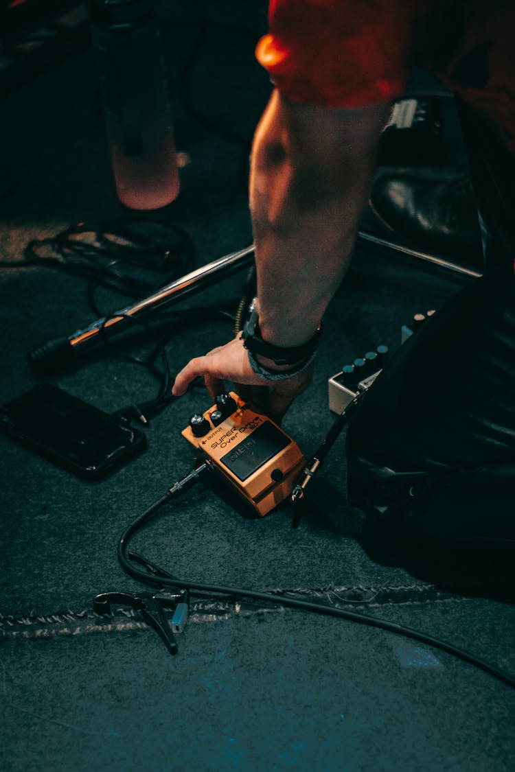 Man Arm Over Device On Ground