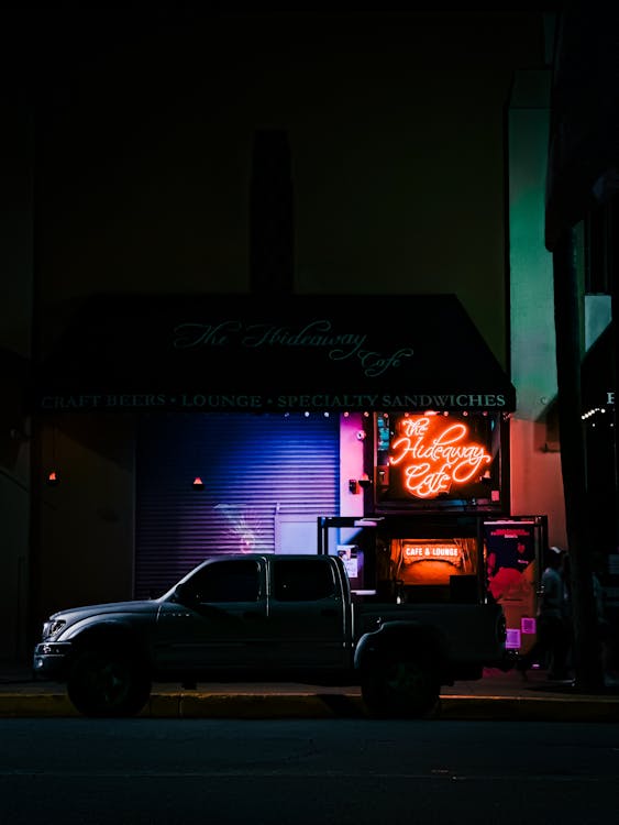 Neon Light over Pick-up Car at Night