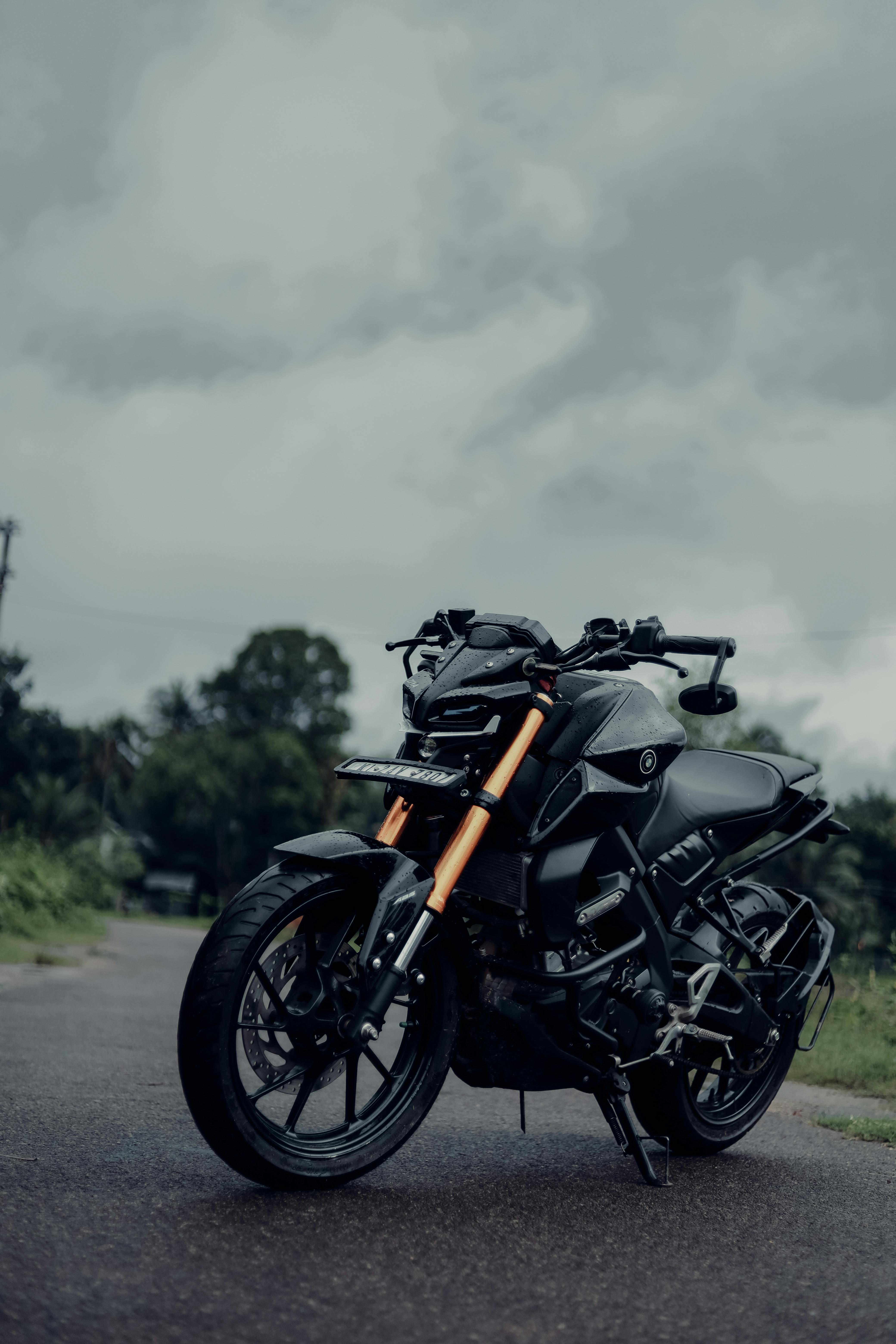 a black yamaha mt on the road