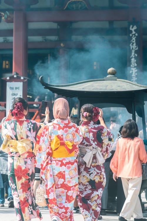 Women in Traditional Clothing in Buddhist Temple