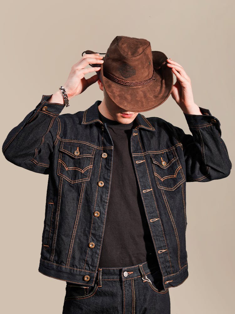 Man In Cowboy Hat And Jean Jacket