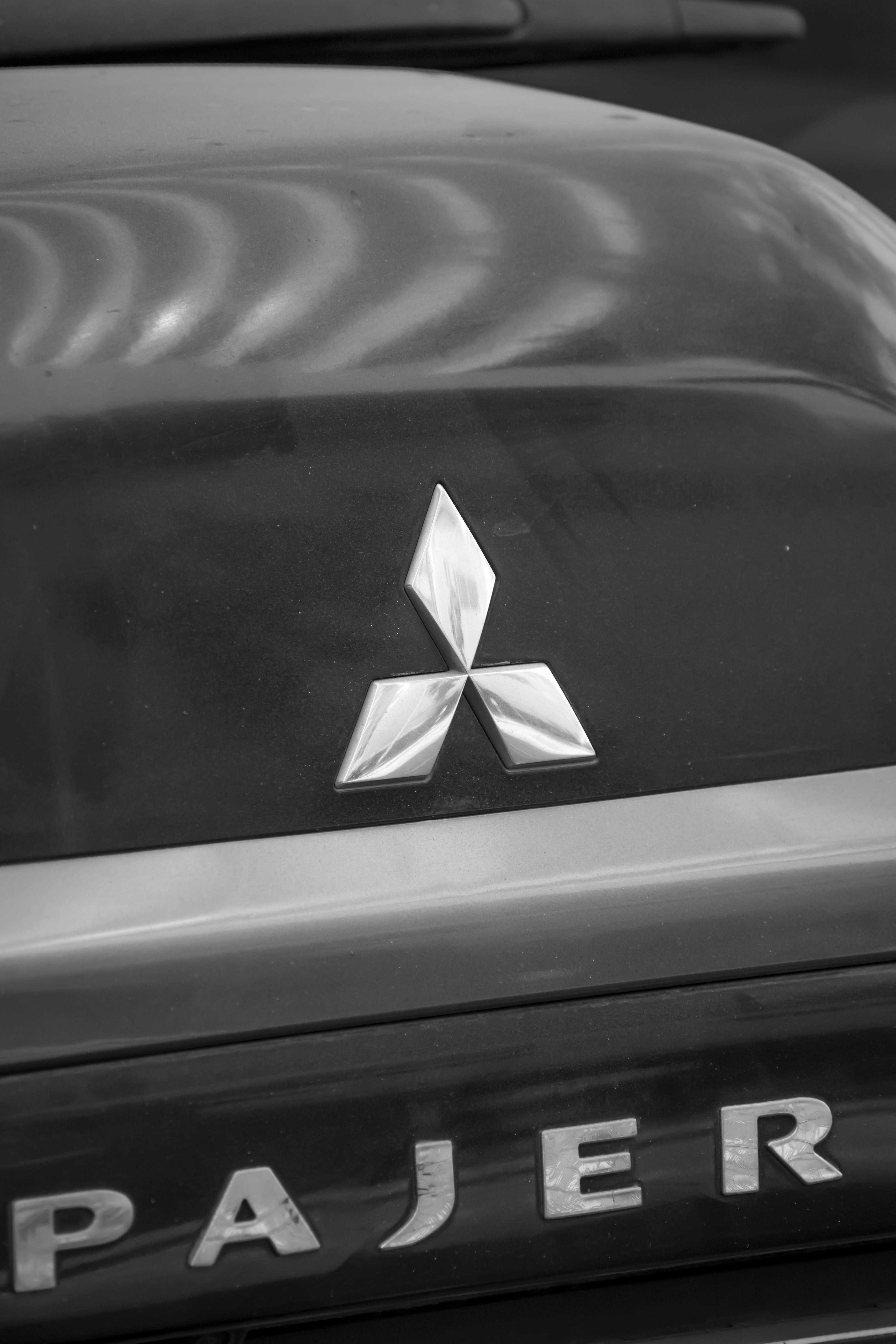 Free Monochrome shot of an SUV emblem showcasing vehicle design elegance. Stock Photo