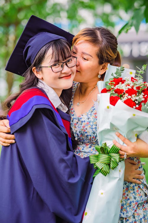 Mother Hugging Graduate Daughter