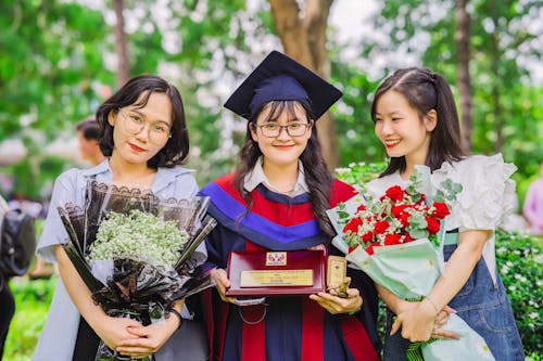 Graduate Student Smiling next to her Friends