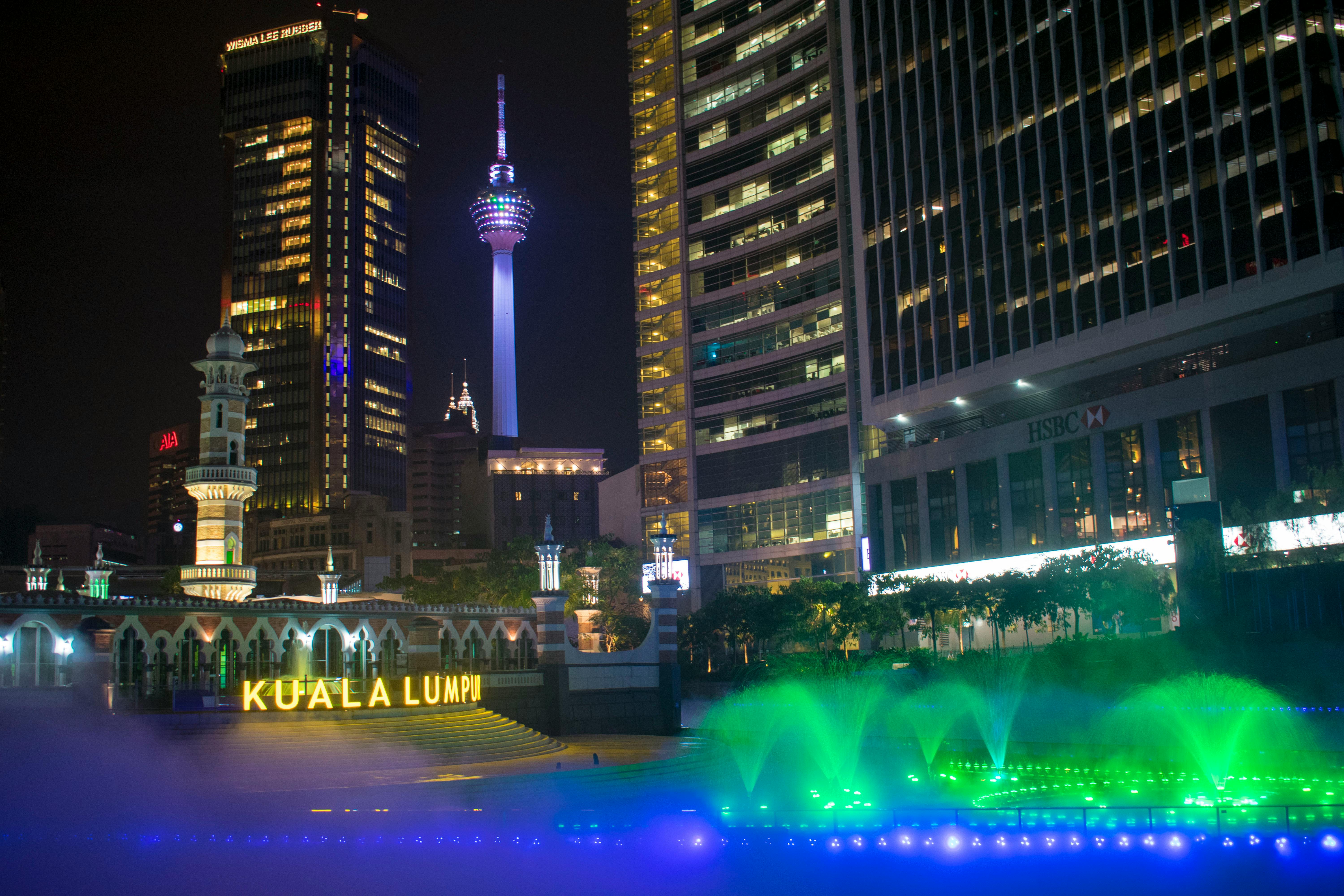 Vendors and shoppers trading vegetables and other produce in a crowded open-air market in New Delhi, India