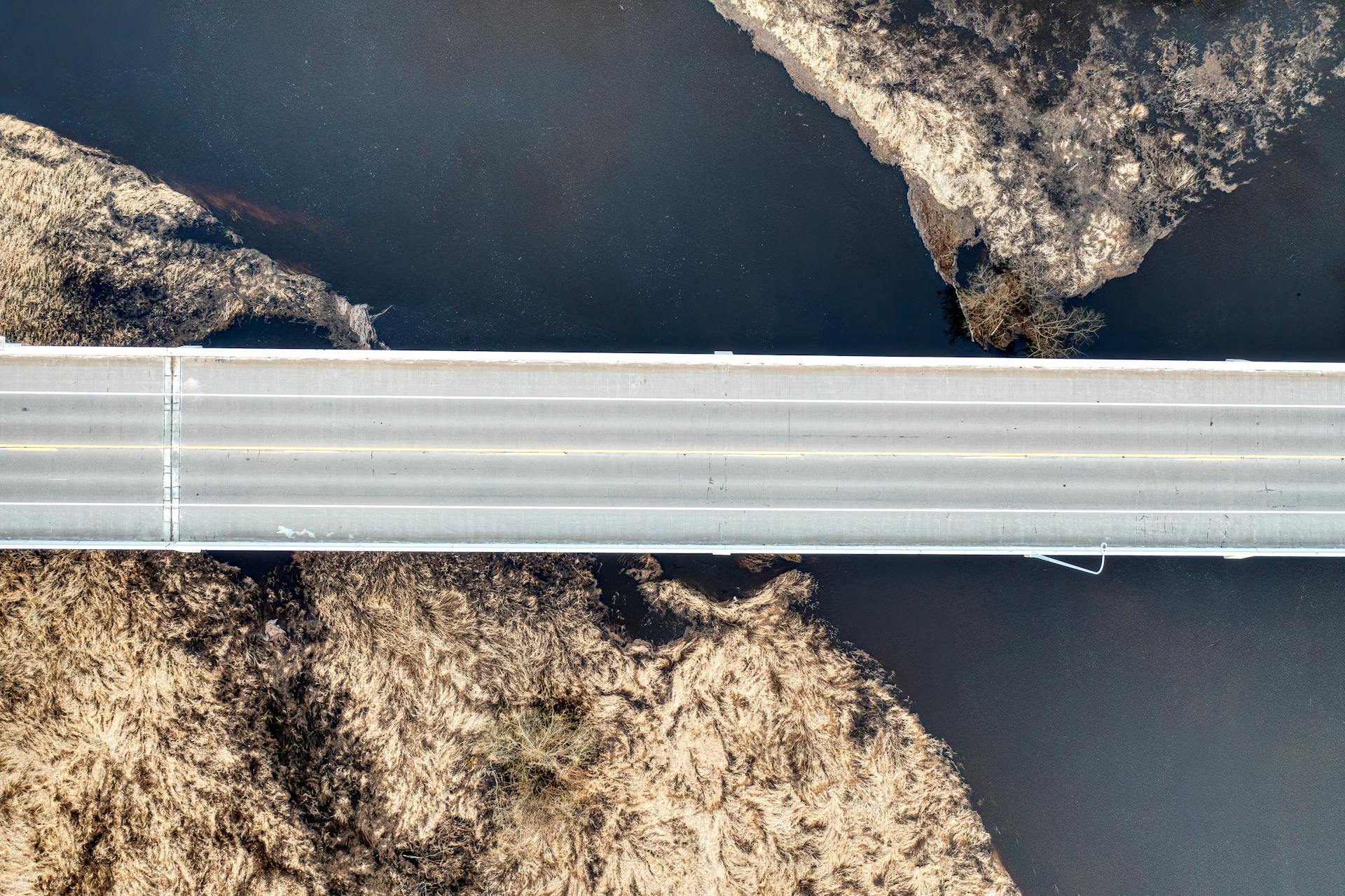 Aerial shot of a bridge crossing a scenic river and landscape view in Wabasha, Minnesota.