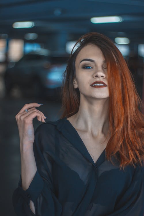 Photo of Smiling Woman Wearing Red Lipstick