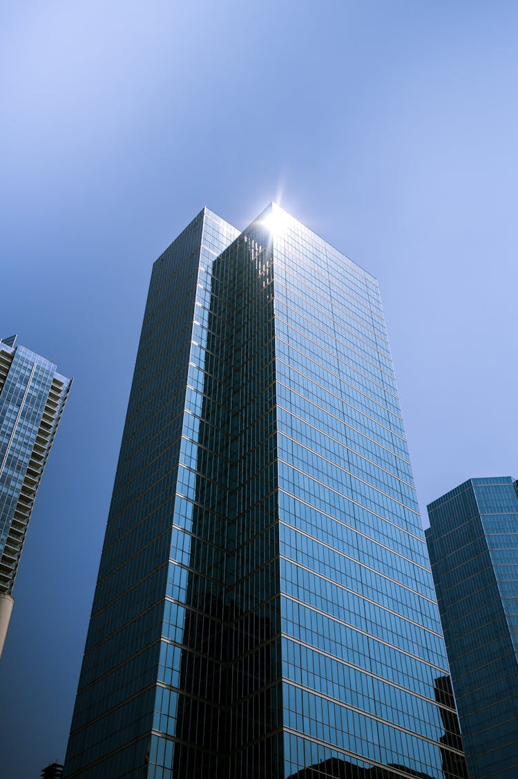 Sunlight Reflecting Off Of Glass High Rise Building