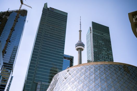 Downtown Toronto skyline showcasing the CN Tower among modern skyscrapers on a sunny day.