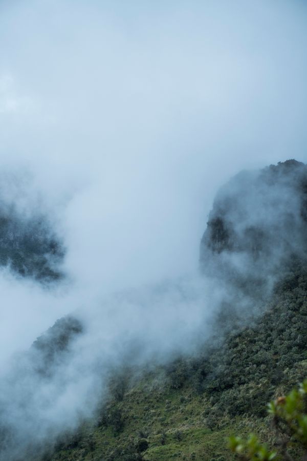 A mountain face half hidden by cloud — photo by Juan Felipe Ram&iacute;rez on Pexels