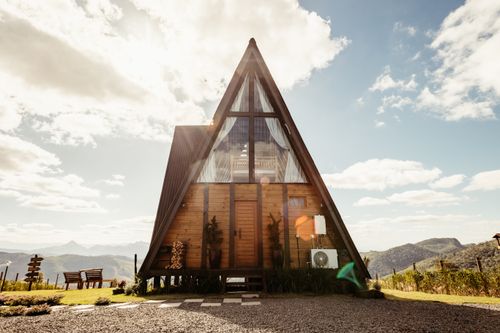Free Explore a charming A-frame cabin in Santa Teresa, Brazil with stunning mountain views and modern architecture. Stock Photo