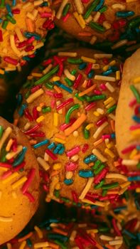 Close-up of vibrant concha pastries with sprinkles, showcasing Mexican pan dulce.