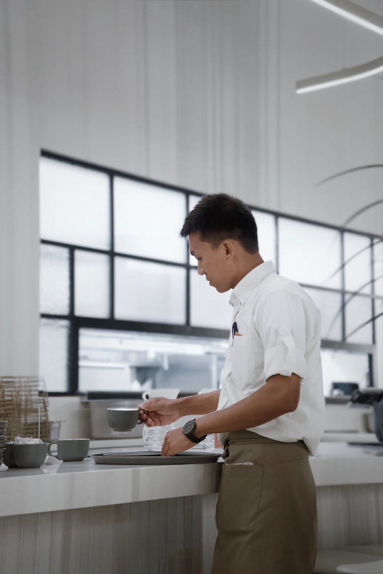 Waiter Standing Near Counter