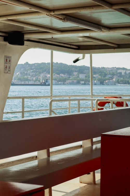 Free Interior of an empty ferry with a clear seaside view, showcasing peaceful travel vibes. Stock Photo